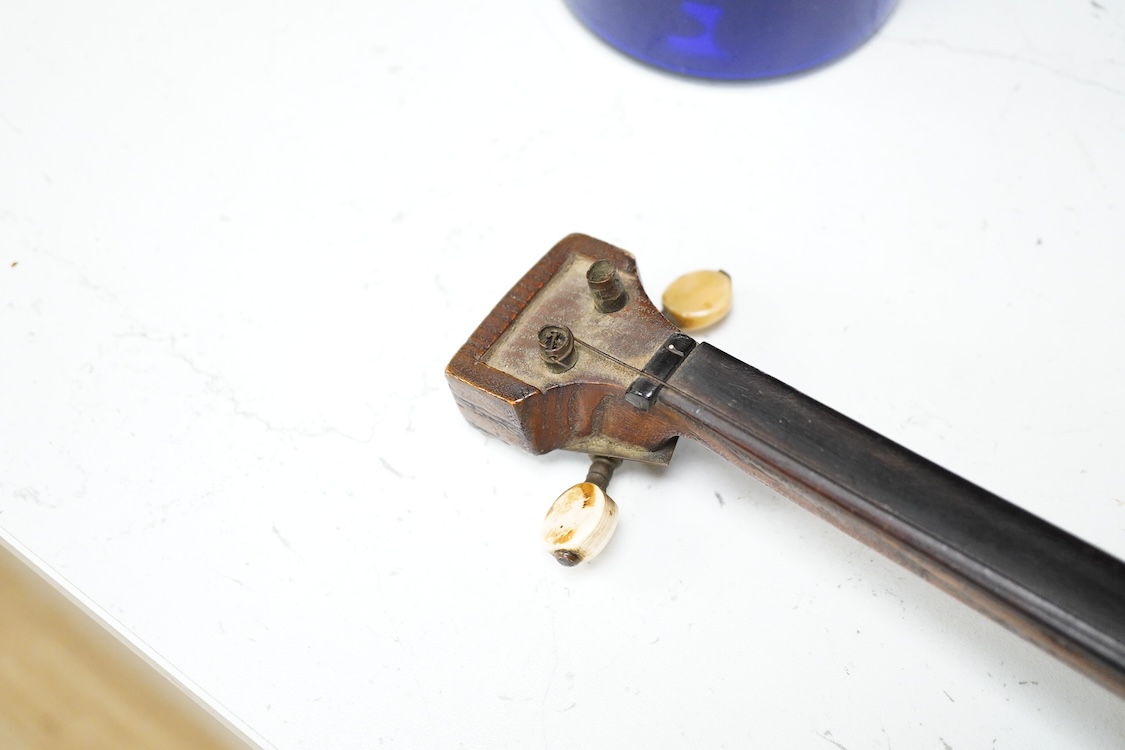 A Mongolian two stringed Morin Khuur musical instrument, 71cm overall